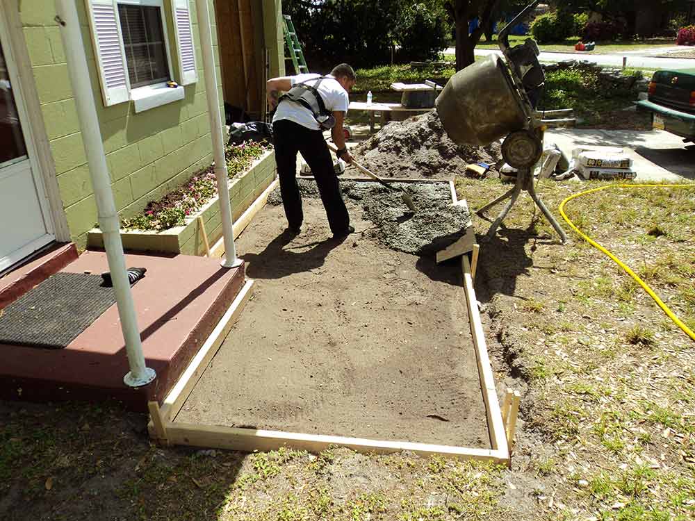 Handyman pouring a concrete slab